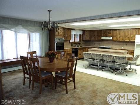 Spacious kitchen with large snack bar & 5 chairs is open to the  dining area.