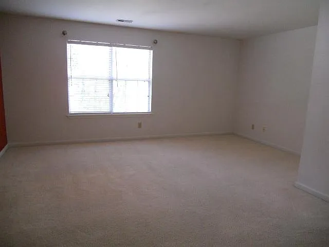OLDER PHOTO - UPDATED PAINT/FLOORING
 LARGE PRIMARY BEDROOM SUITE WITH SITTING AREA, VANITY AND WALK IN CLOSET