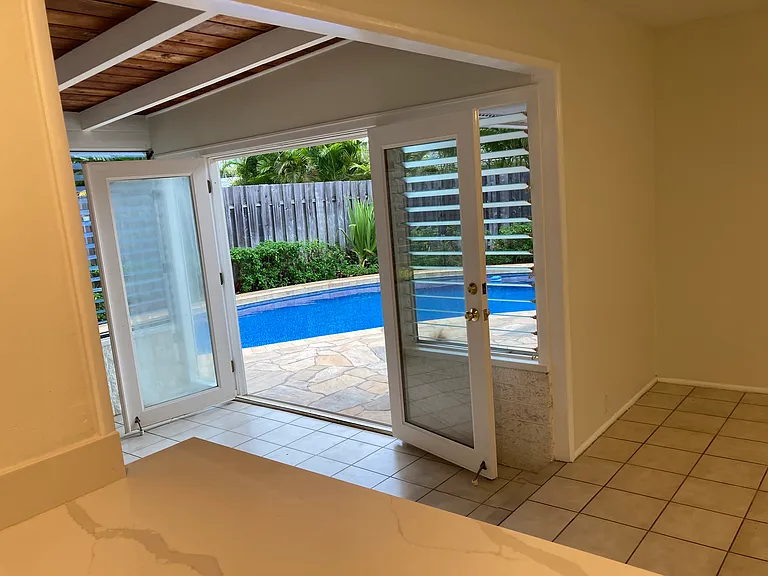 Kitchen view to pool and dining room.