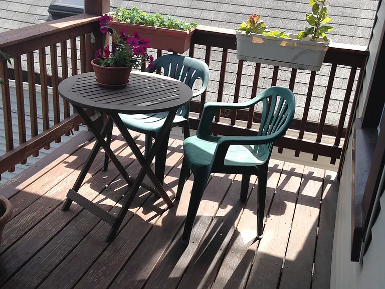 Balcony in the back - off the kitchen on the 2nd floor - plenty of space for a table & chairs, grill, and planters
