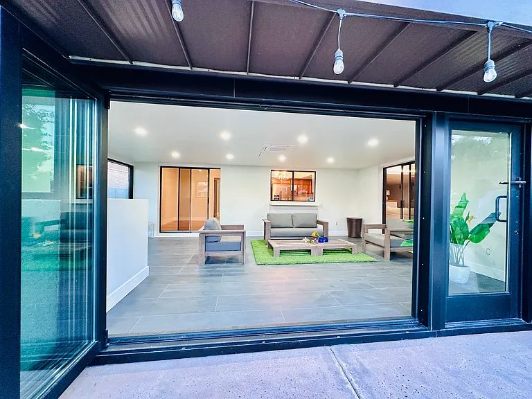Nice, big indoor patio with expansive glass door.