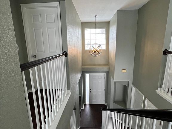 Stairs and entry area from the upper level.