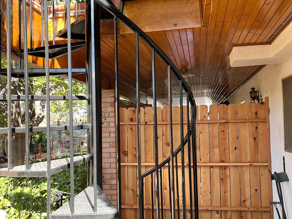 Spiral staircase to entrance of Apartment