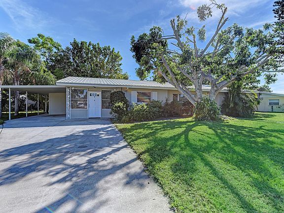 front of house w/carport & family room entrance