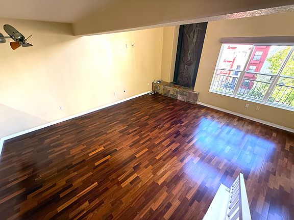Floor to ceiling windows with remote control blackout blinds. Built-in water feature in the corner. Spacious dining area.