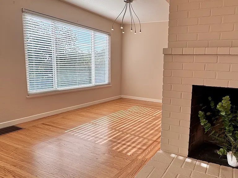 The living room transitions naturally into the dining area.