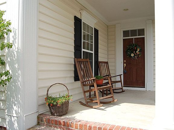 The The shaded side porch is the perfect place for reading the morning news!