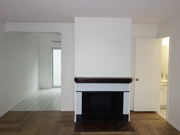 New Custom Mantle! On the right you have a coat closet, half-bath, and an understairs storage closet
