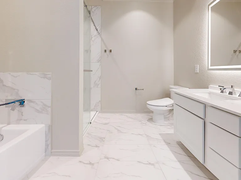 Primary Ensuite with Dual Vanities and Separate Tub Shower