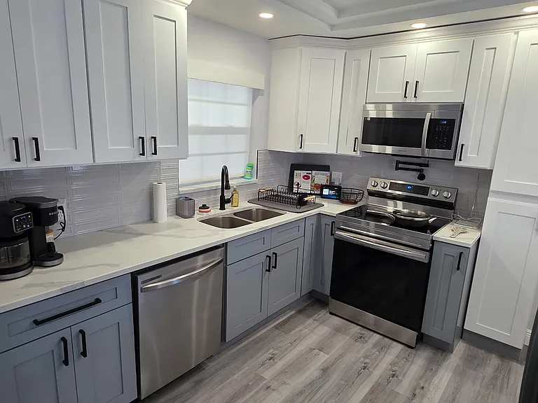 Kitchen - stocked with pots, pans, plates, glassware, mugs, keurig, instapot, cutting boards, cutlery, cooking utensils