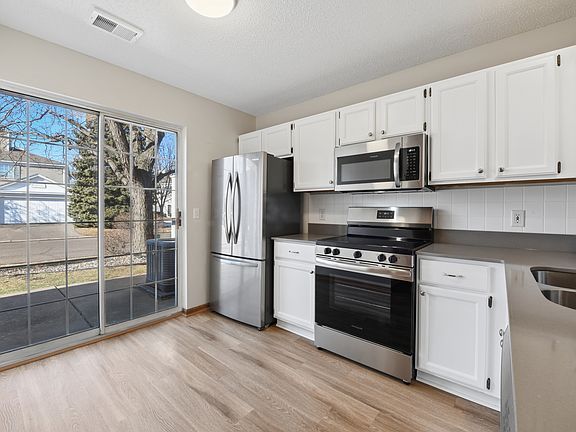 Updated kitchen with brand new stainless steel appliances and quartz countertops.