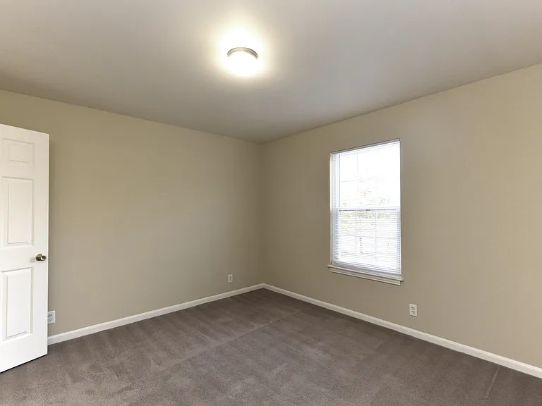 Bedroom with carpet