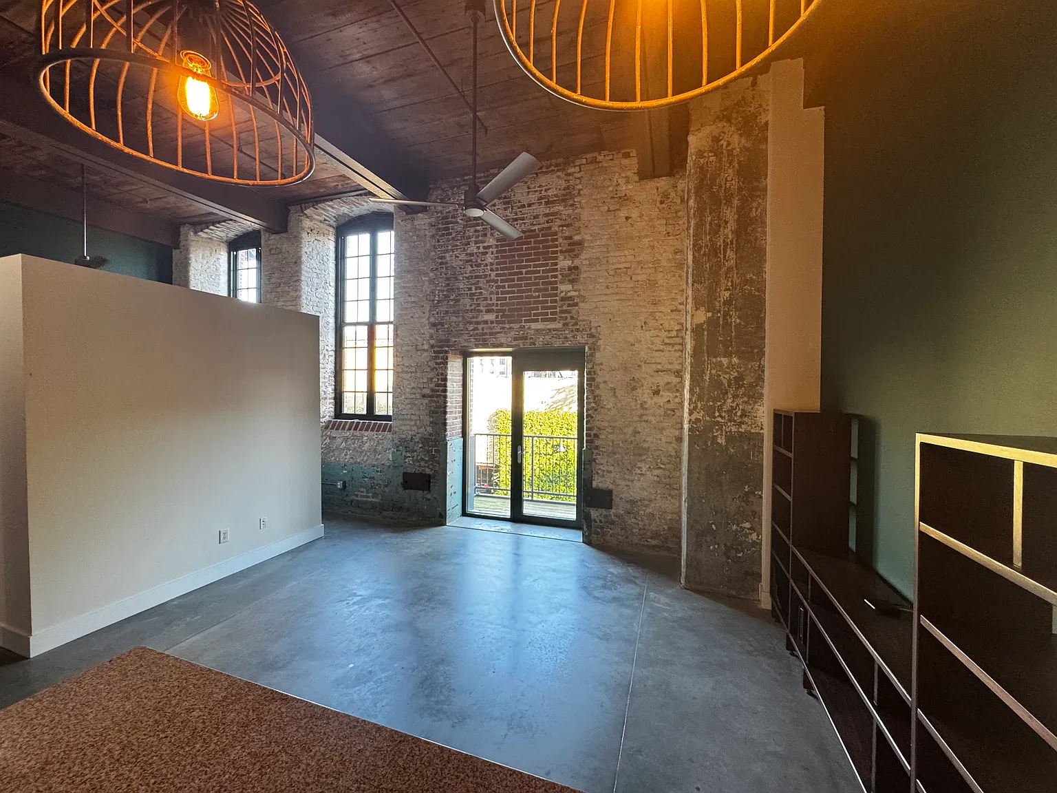 Living Area view from Kitchen. Doors to porch area