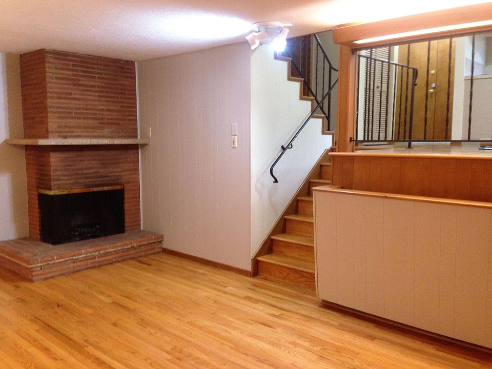 Spacious great room with wood-burning fireplace, hardwoods,