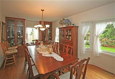 Oversized dining room with built-in hutch and hardwood floors. This dining room will hold all your favorite pieces.