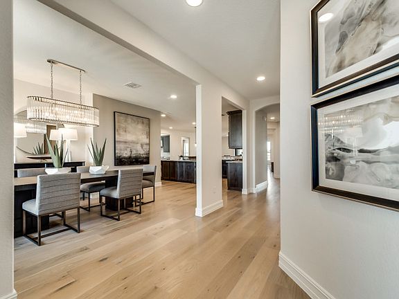 Foyer overlooks formal dining and into the kitchen