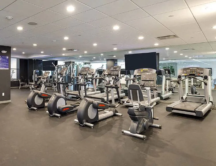Fitness Center with Cardio Machines, Free Weights, and a TV