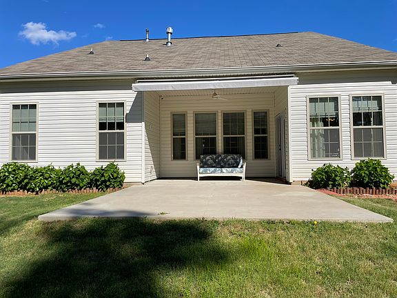 Back View of House highlighting patio with Sunsetter retractable awning