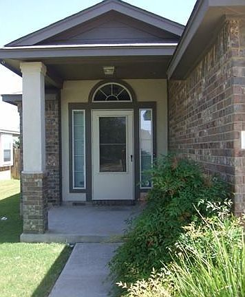 Cute entry with covered porch.