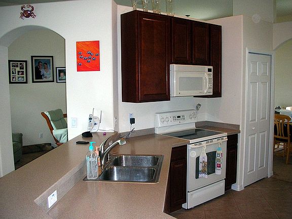 Kitchen with corian and maple cabinets