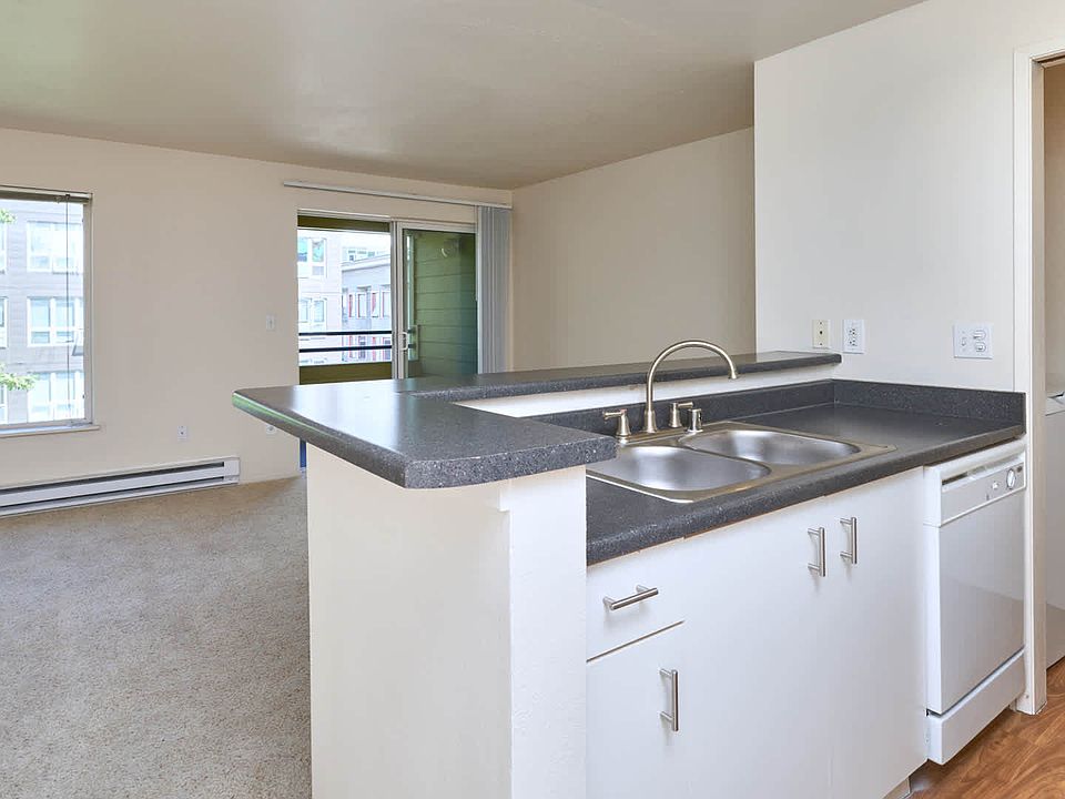 Kitchen and Carpeted Studio with Balcony