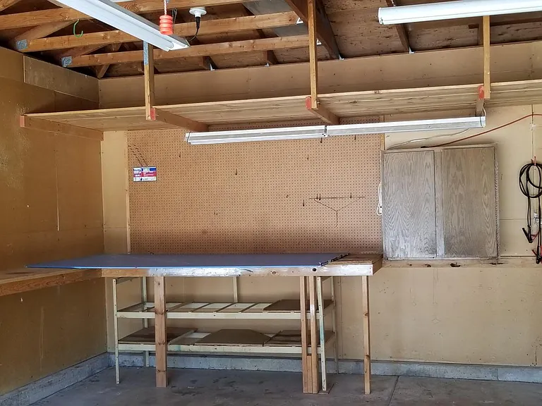 2 car garage with work bench.