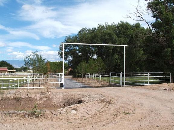 IRRIGATION MAIN DITCH RUNS ON THE WEST S