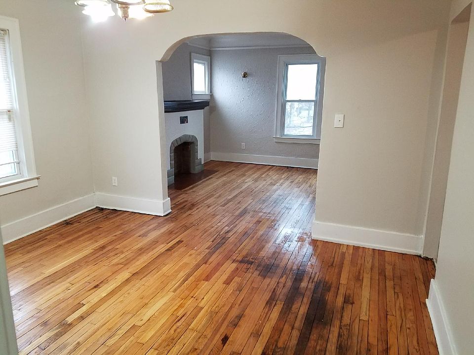 Dining Room looking toward Living Room. Floors are original and have been refinished - stains are permanent. :(