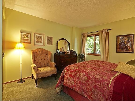 Large carpeted bedroom.