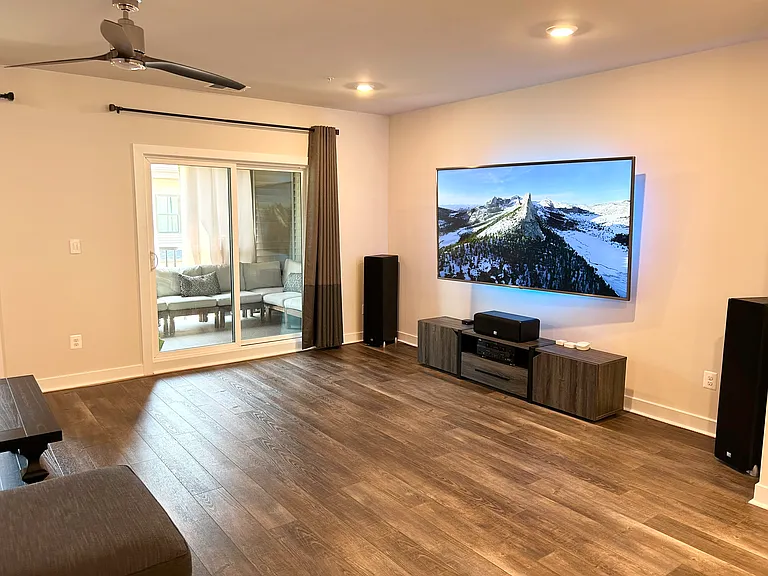 Living room comes with high end Sanus full motion TV mount with in-wall HDMI cable management and ethernet outlet. Easily fits 86" TV (pictured).