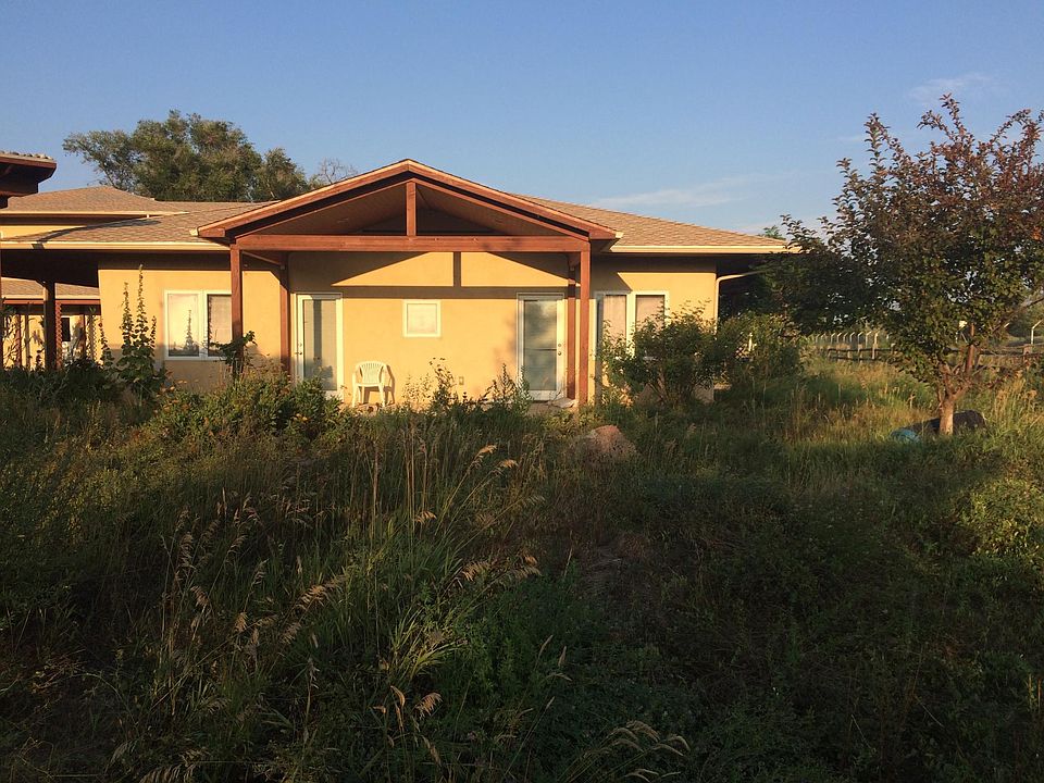 House has a patio on the west and south sides. The patio shown makes a cozy evening relaxation station where you can watch the sunset.