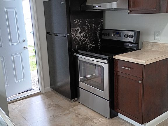 full size refrigerator, range oven, range exhaust hood