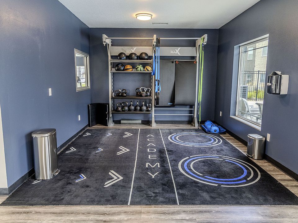 The fitness center is equipped for full-body workouts, including resistance bands, medicine balls, and kettlebells.