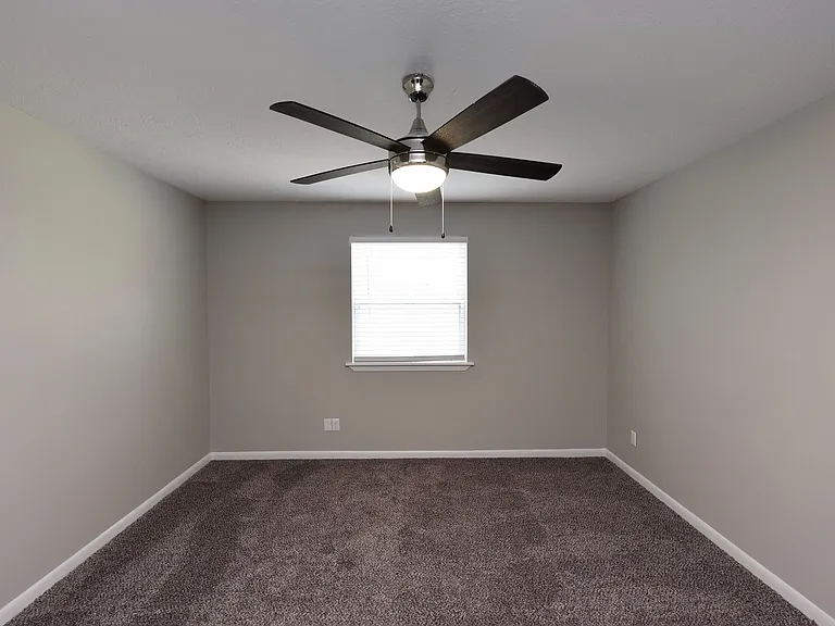 Bedroom with carpet & ceiling fan