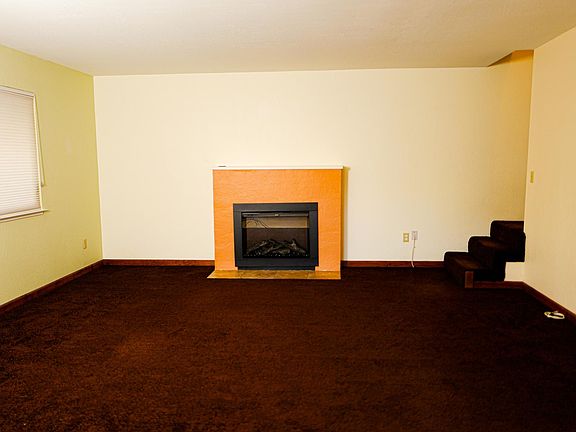 living room with fireplace insert