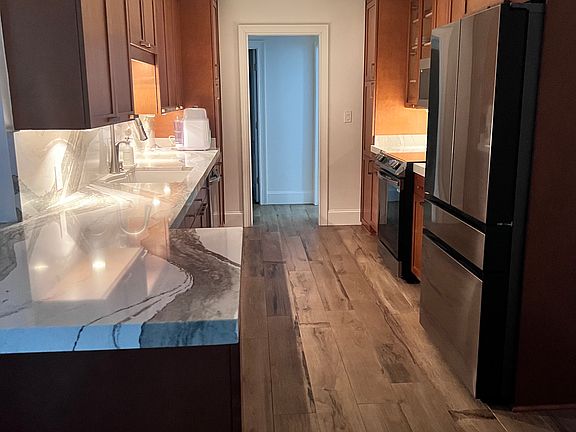 Lights under the cabinets provide this space soft lighting.