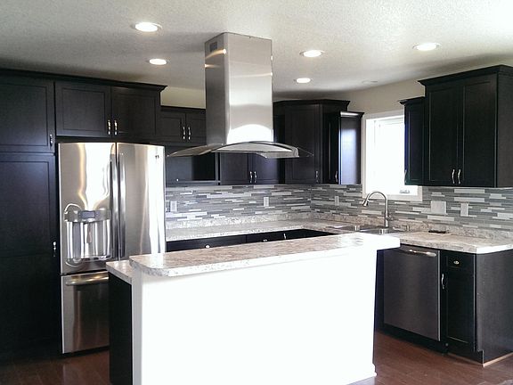 Beautiful modern kitchen with Stainless appliances and tile 