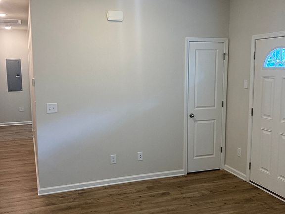 Great Room is just inside the front door and the bedrooms are down the long hall.