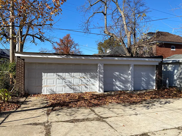 4-car garage with new openers behind the house.