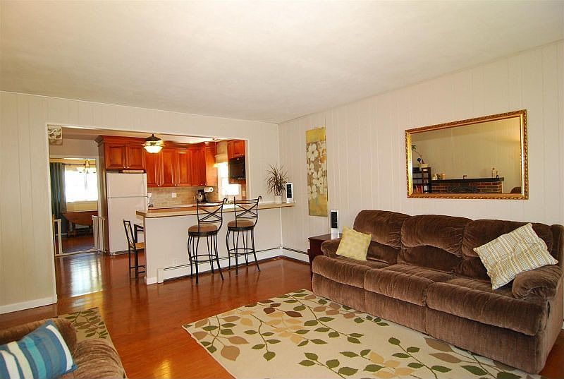 Living Room with view of Breakfast Bar and Kitchen