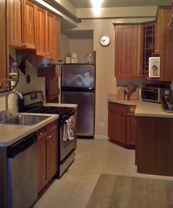 Kitchen: custom cherry cabinets, stainless steel appliances