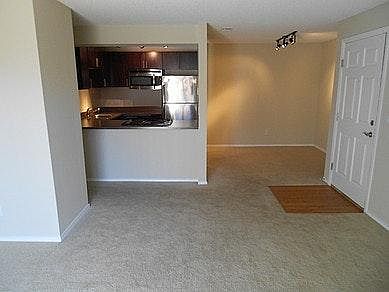 Living room, kitchen, and nook for dinning or office