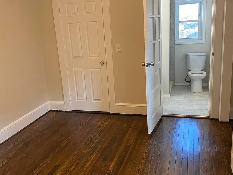 master with hallway exit on left and on suite on right