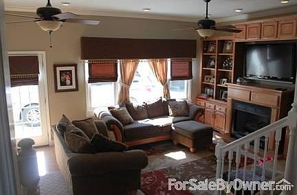 Living Room w/ Boookcase & fireplace : Very Open Room leading outside/french doors to screen porch. 