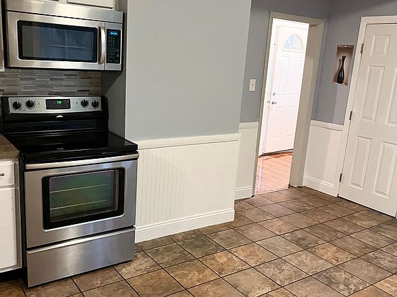 Kitchen with ceramic tile and stainless appliances