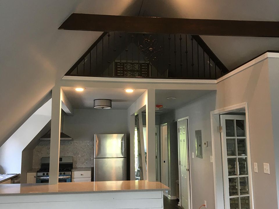 Looking into the kitchen and loft areas from great room