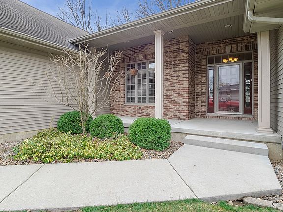 ~Inviting front porch is the perfect place for morning coffee or evening drinks~