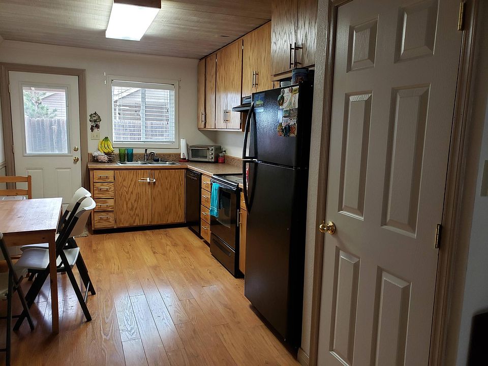 Unit 2 Kitchen Layout: Pantry Door and Door to the Back Patio. Dining Table area on the side.