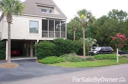 Outside view
						:
						View of condo with screen porch and parking underneath bldg