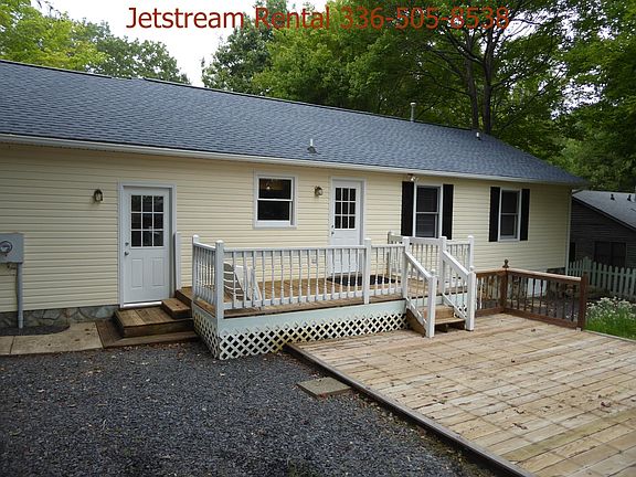 Back of home with deck